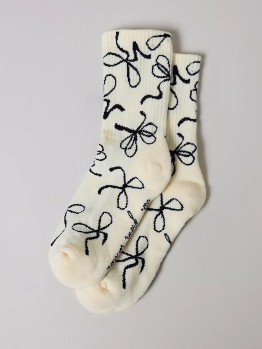 Urban Outfitters Cream Socks with Black Bow Pattern